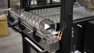 Depalletizer with single lane discharge conveyor